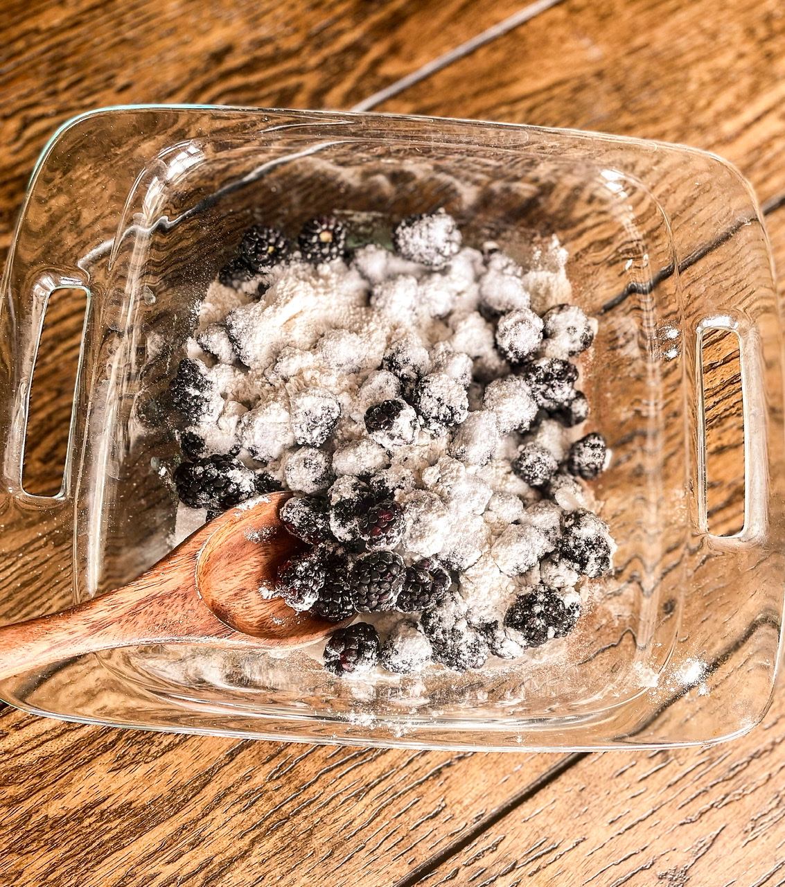 blackberries covered with sugar and flour in baking dish