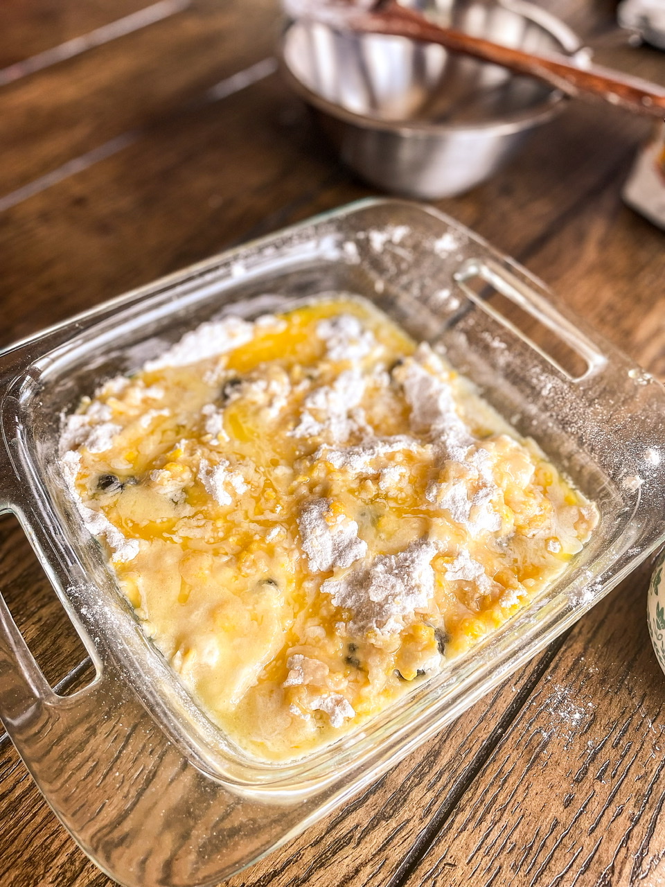 melted butter over blackberry cobbler