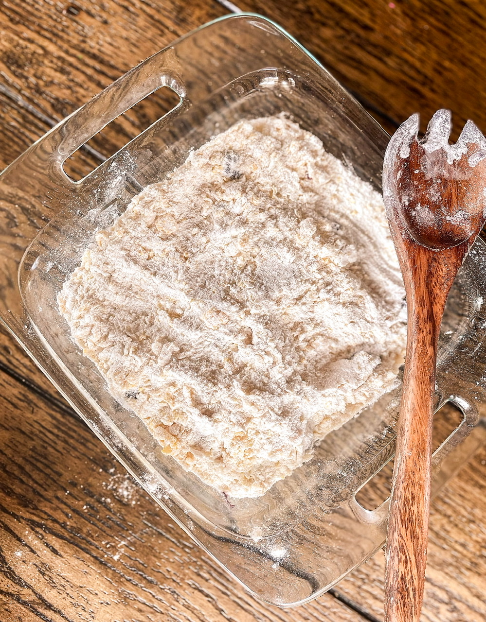 dry mixture topping over blackberry cobbler