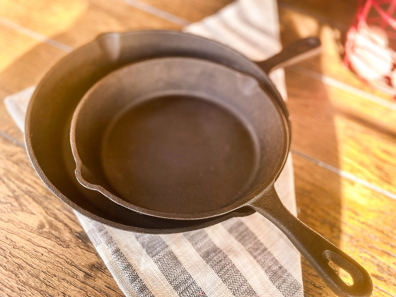 two cast iron pans on a napkin