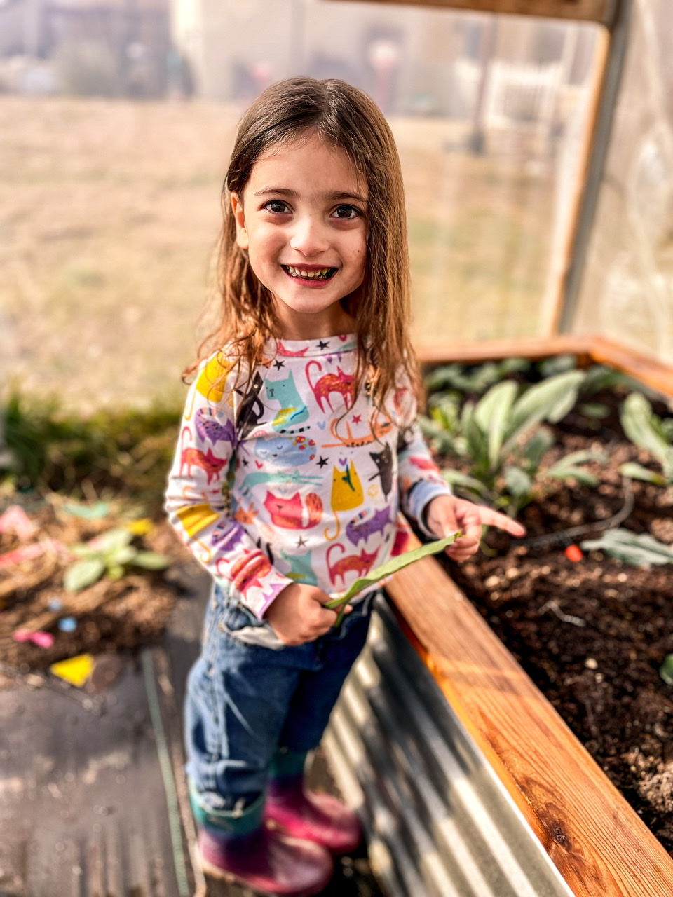 Little girl in a high tunnel