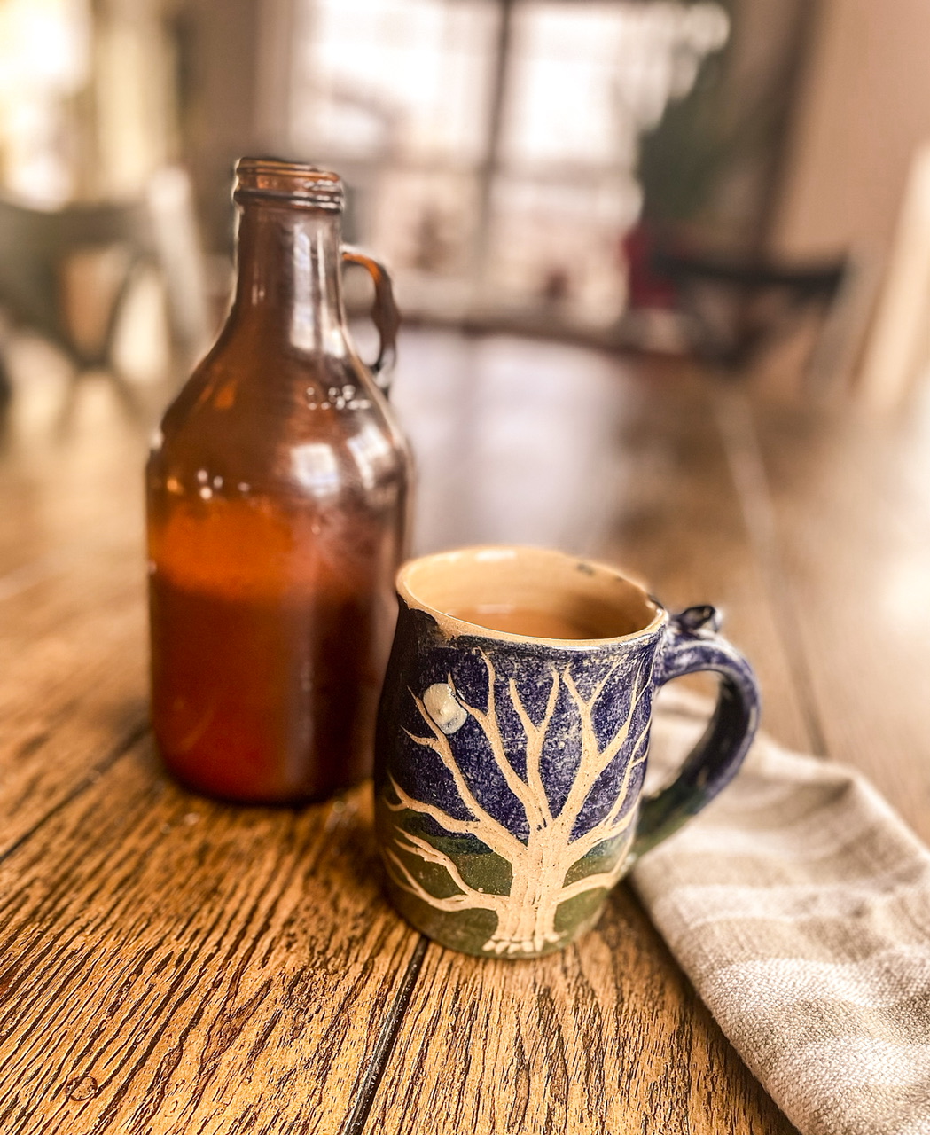 jar of coffee creamer with coffee mug