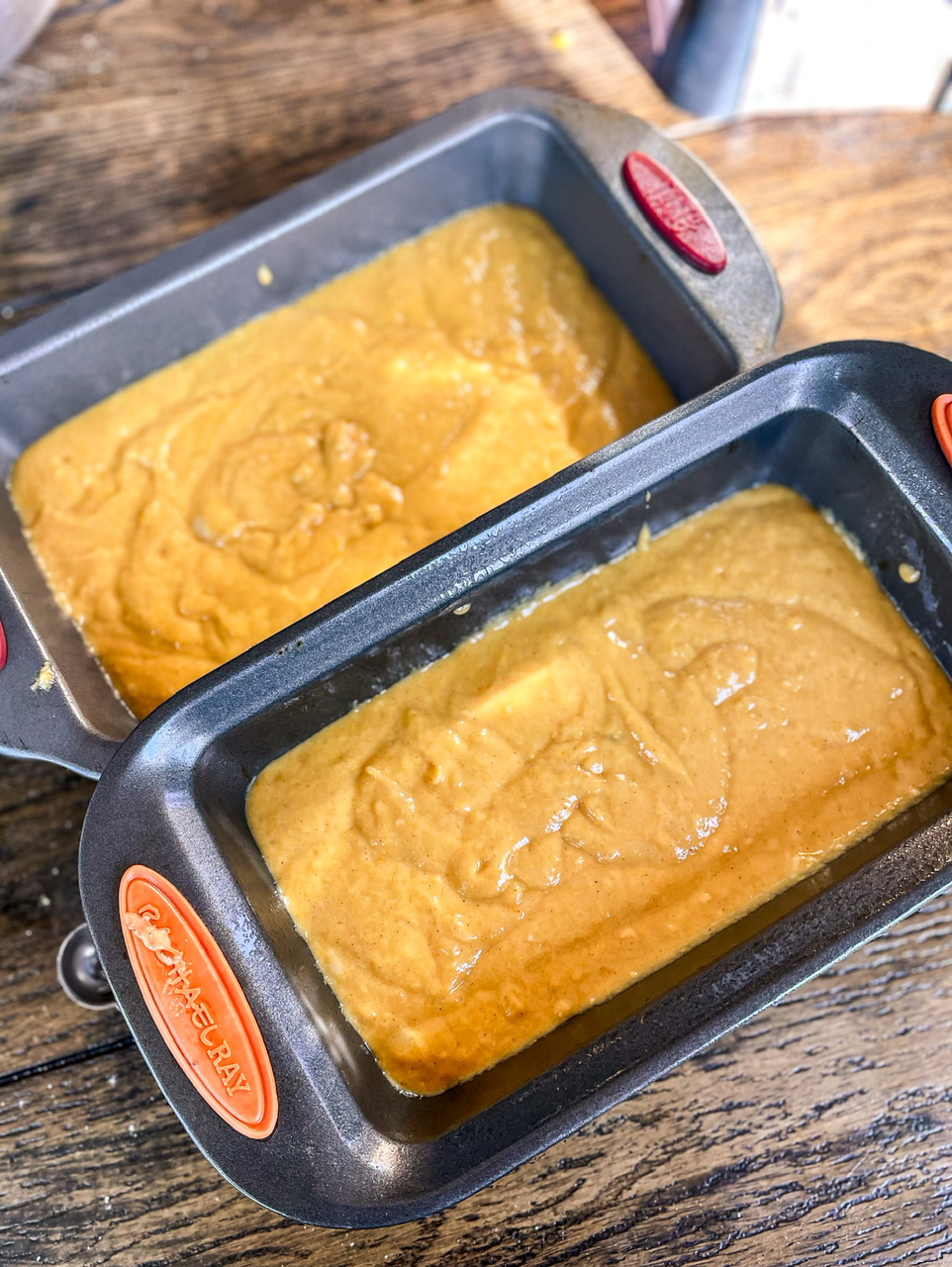 pumpkin bread batter in two loaf pans