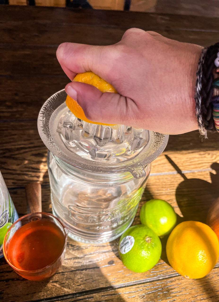 Hand squeezing lemon to make juice