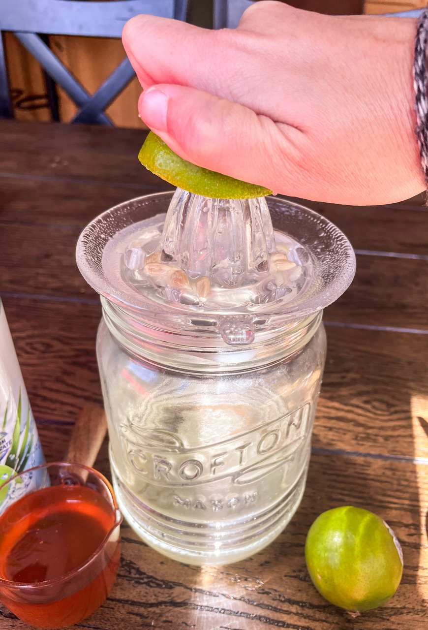 Hand squeezing a lime